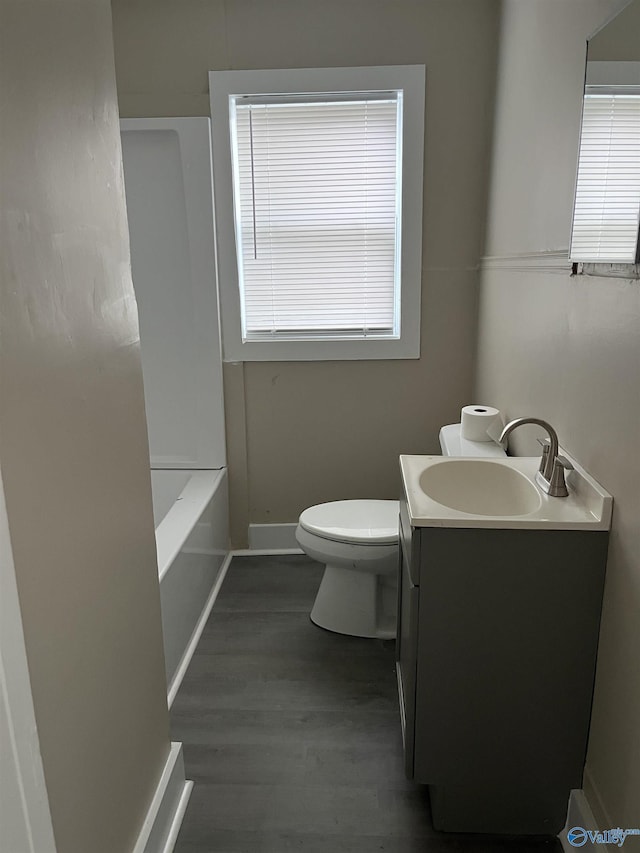 1014 7th Ave, Decatur, AL 35601 - bathroom featuring vanity, wood finished floors, and bathing tub / shower combination