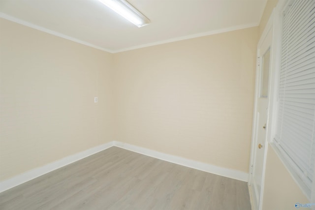 1014 7th Ave, Decatur, AL 35601 - empty room featuring light wood finished floors and crown molding