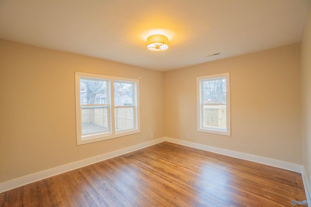 1014 7th Ave, Decatur, AL 35601 - spare room with healthy amount of natural light and wood finished floors