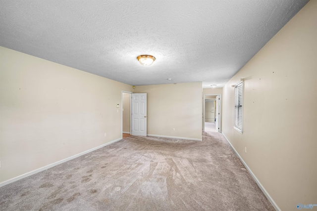 2211 Pumpkin Center Rd NE, Fort Payne, AL 35967 - empty room featuring carpet, a textured ceiling, and baseboards