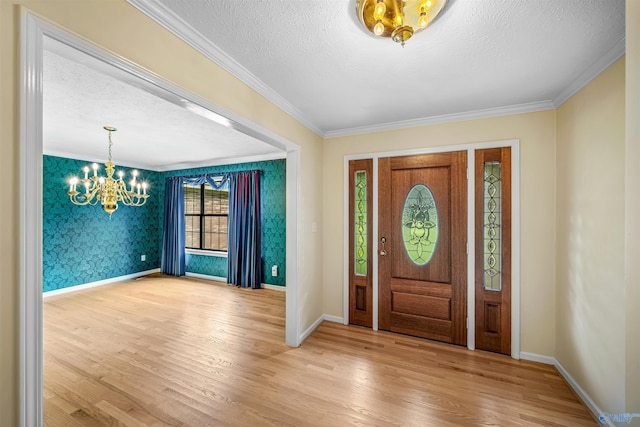 2211 Pumpkin Center Rd NE, Fort Payne, AL 35967 - entryway featuring a chandelier, wood finished floors, baseboards, a textured ceiling, and ornamental molding