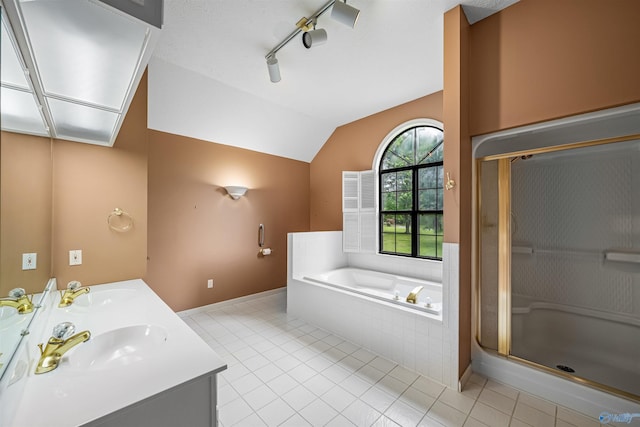 2211 Pumpkin Center Rd NE, Fort Payne, AL 35967 - full bath with a bath, vaulted ceiling, a shower stall, double vanity, and tile patterned floors