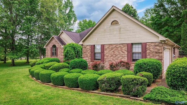 2211 Pumpkin Center Rd NE, Fort Payne, AL 35967 - view of front of house with brick siding, a front yard, and a garage