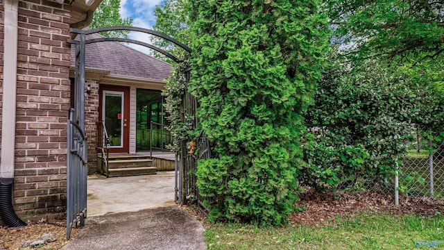2211 Pumpkin Center Rd NE, Fort Payne, AL 35967 - property entrance with brick siding and roof with shingles
