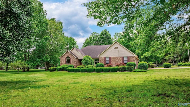 2211 Pumpkin Center Rd NE, Fort Payne, AL 35967 - ranch-style home with a front lawn and brick siding