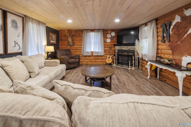 living room featuring wood ceiling, hardwood / wood-style flooring, and rustic walls