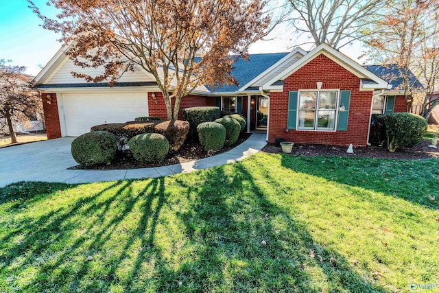 view of front of home featuring a front yard and a garage