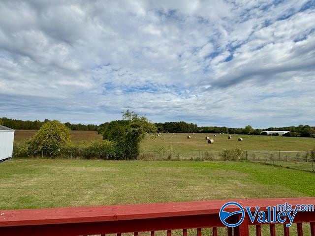 view of yard with a rural view