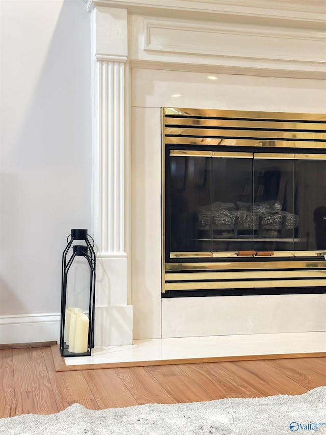 interior details featuring baseboards and wood finished floors