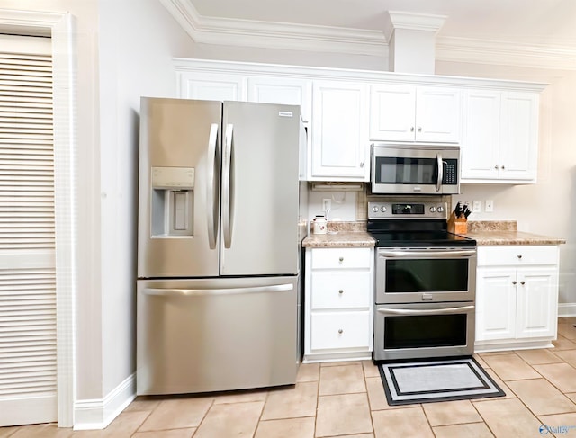 kitchen with stainless steel appliances, white cabinets, crown molding, and light countertops