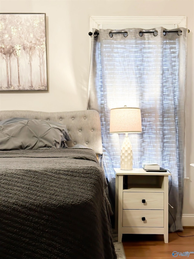 unfurnished bedroom featuring wood finished floors