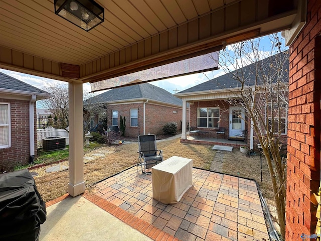 view of patio / terrace with fence and central AC