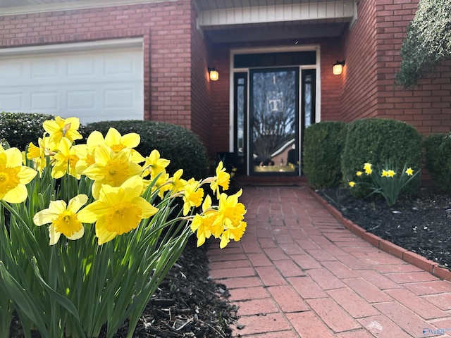 property entrance featuring brick siding