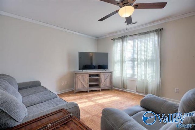 living room with crown molding, ceiling fan, and light hardwood / wood-style floors