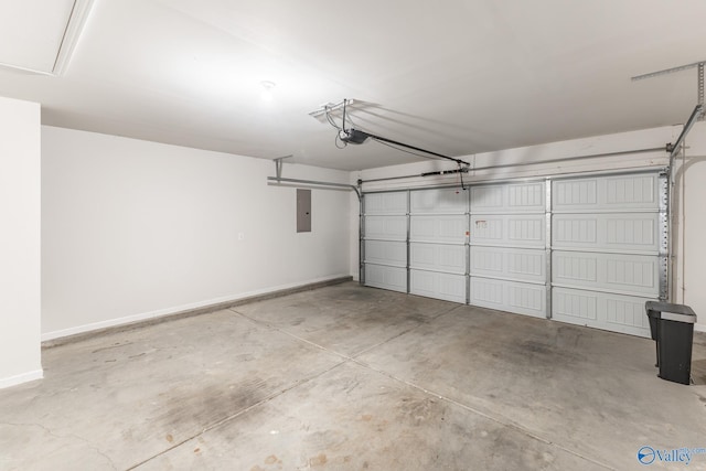 garage featuring a garage door opener and electric panel