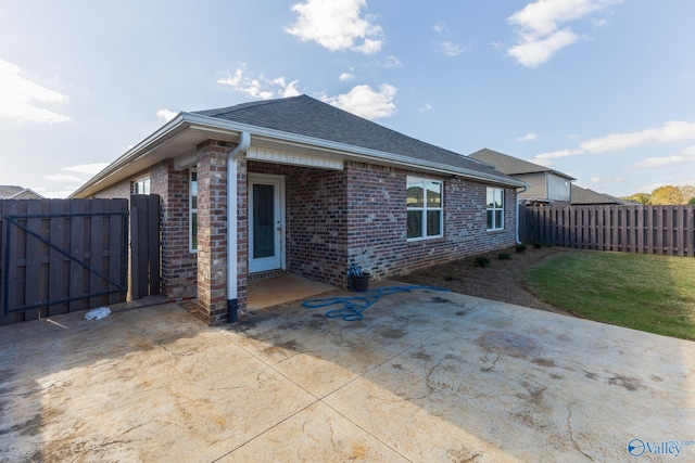 rear view of house featuring a patio