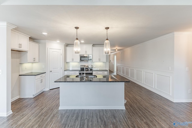 kitchen with a center island with sink, white cabinetry, sink, and dark wood-type flooring