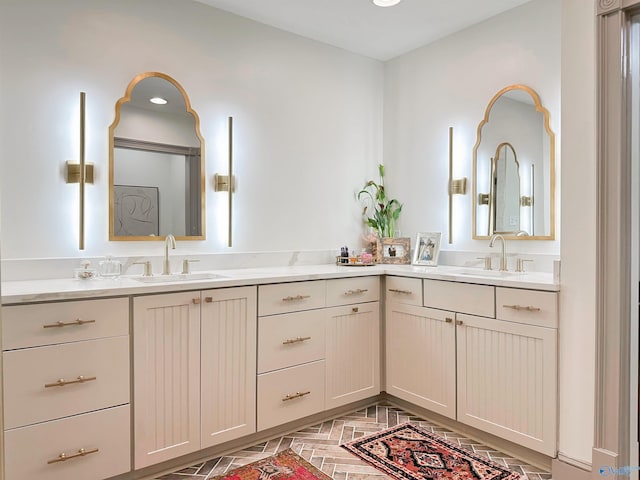 full bath with a sink and double vanity