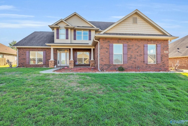 craftsman house featuring a front yard