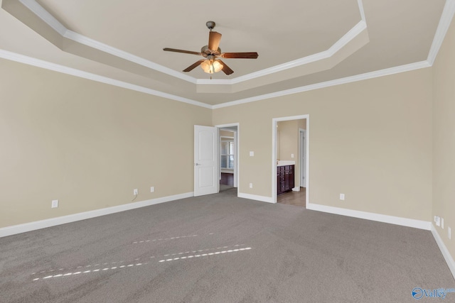 interior space featuring ceiling fan, a raised ceiling, and crown molding