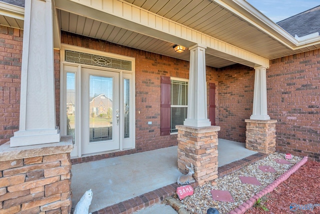 entrance to property featuring a porch