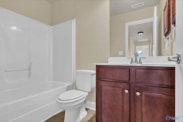 full bathroom featuring shower / tub combination, tile patterned floors, vanity, and toilet