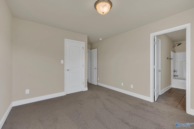 unfurnished bedroom with carpet floors