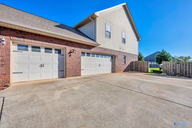 view of side of property featuring a garage