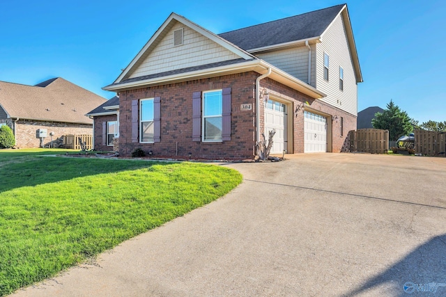 view of front of home featuring a front yard and a garage