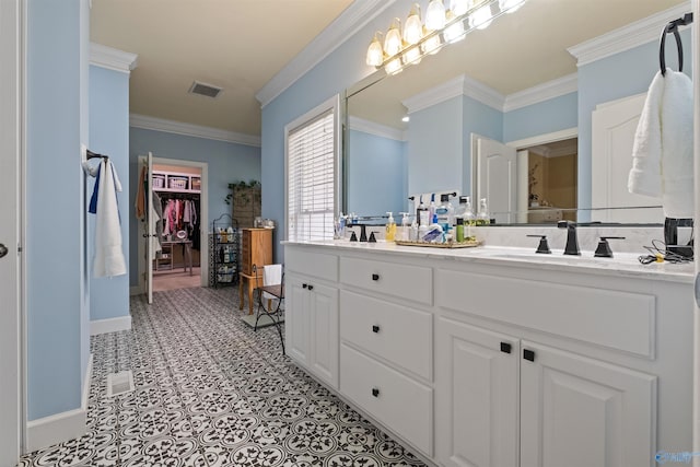 bathroom featuring vanity, tile patterned flooring, and ornamental molding