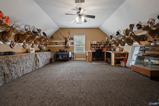 bonus room featuring ceiling fan, lofted ceiling, carpet, and a textured ceiling