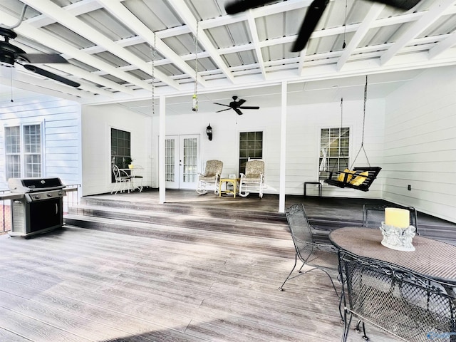 deck featuring ceiling fan, grilling area, and french doors