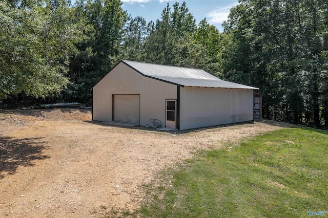 garage with a yard