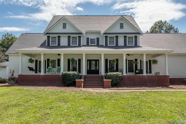 country-style home featuring a front yard and a porch