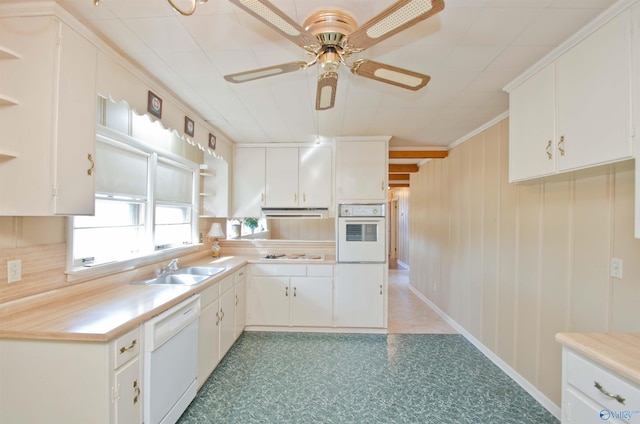 kitchen with white appliances, light countertops, a sink, and open shelves