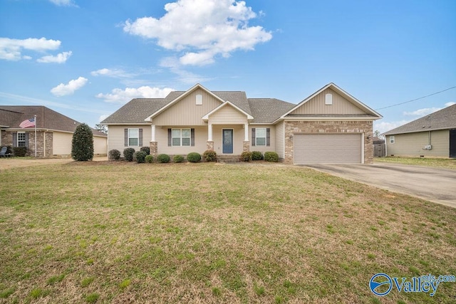 view of front of property with a garage, concrete driveway, and a front lawn