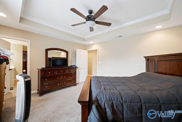 bedroom with light carpet, visible vents, a raised ceiling, ornamental molding, and recessed lighting