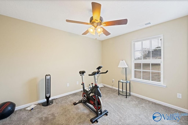 workout room featuring a ceiling fan, carpet, visible vents, and baseboards