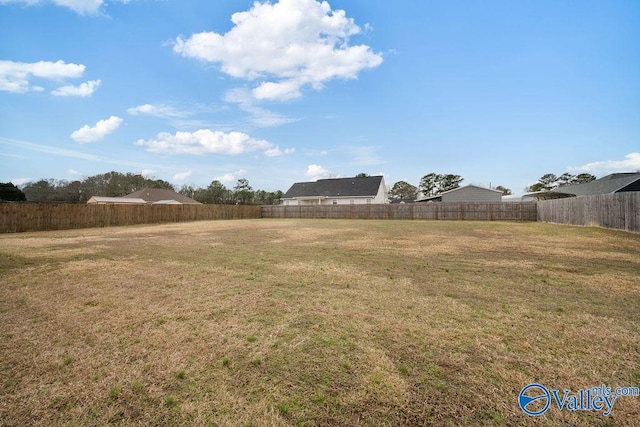 view of yard with a fenced backyard