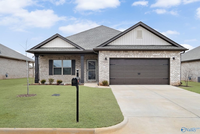 view of front of property featuring a garage and a front yard