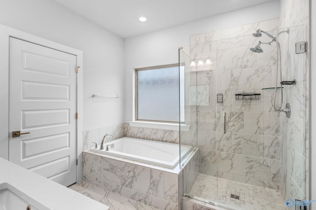 bathroom with separate shower and tub