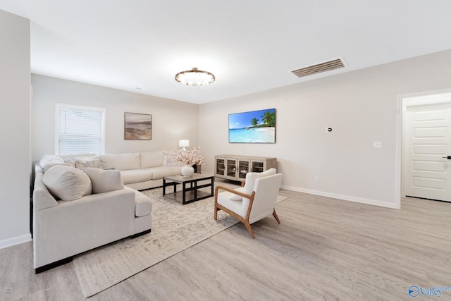 103 Barlow Way, Owens Cross Roads, AL 35763 - living room featuring light wood finished floors and baseboards