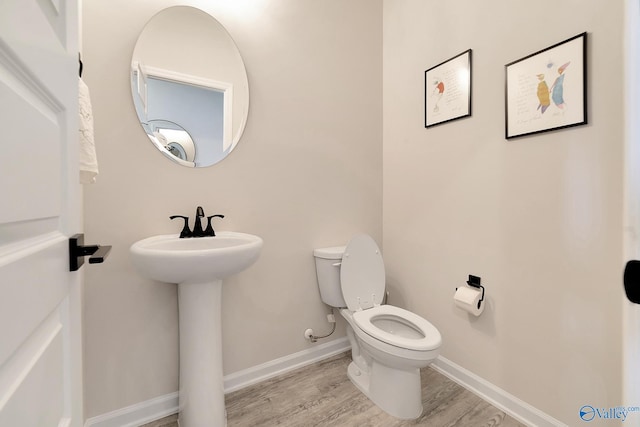 103 Barlow Way, Owens Cross Roads, AL 35763 - half bath featuring toilet and wood finished floors