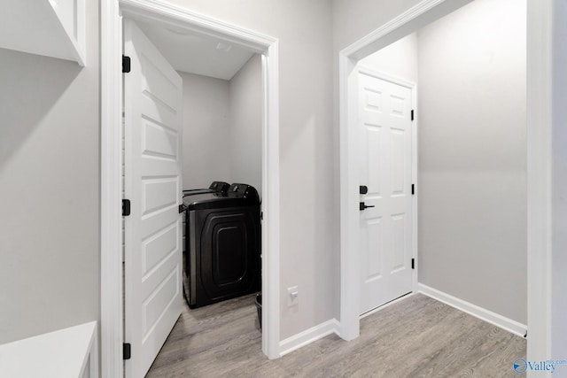 103 Barlow Way, Owens Cross Roads, AL 35763 - hallway with washer / dryer and light wood-style floors