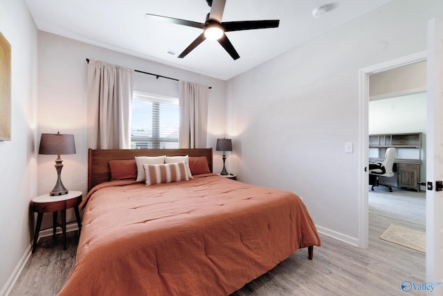 103 Barlow Way, Owens Cross Roads, AL 35763 - bedroom featuring light wood-style flooring, a desk, and a ceiling fan