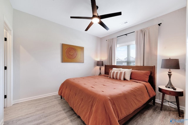 103 Barlow Way, Owens Cross Roads, AL 35763 - bedroom with light wood finished floors and a ceiling fan