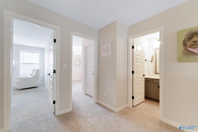 103 Barlow Way, Owens Cross Roads, AL 35763 - hallway featuring light carpet and baseboards