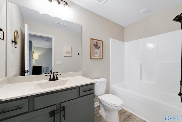 103 Barlow Way, Owens Cross Roads, AL 35763 - bathroom featuring vanity, wood finished floors, and shower / bathtub combination