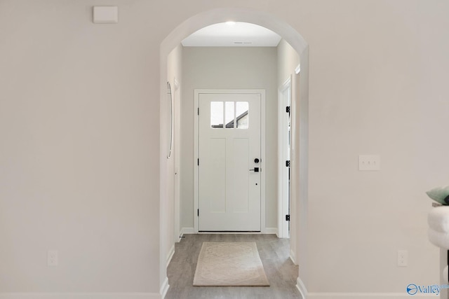 103 Barlow Way, Owens Cross Roads, AL 35763 - doorway to outside with arched walkways and light wood-style floors