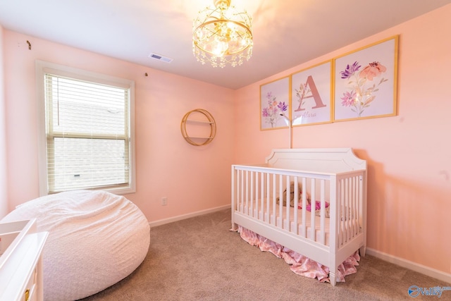 103 Barlow Way, Owens Cross Roads, AL 35763 - carpeted bedroom with a chandelier and baseboards